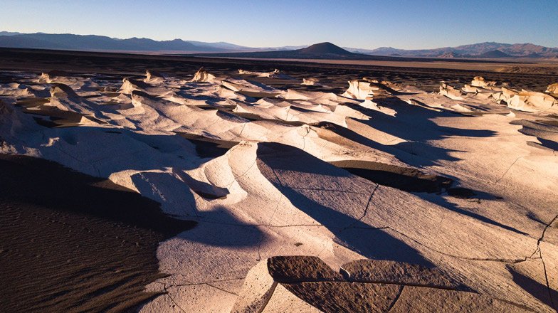 Visit the Salinas Grandes, a salt mirror stretching for more than 30,000 acres