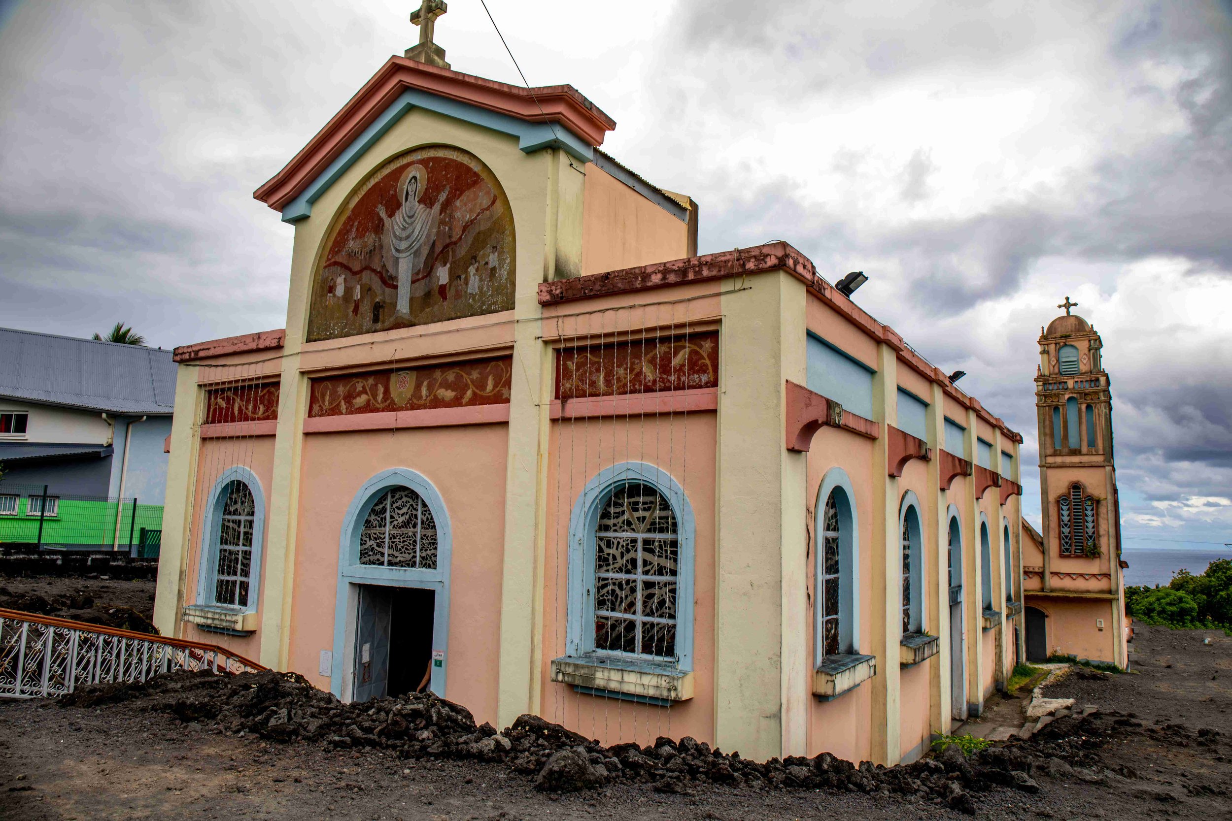 Discover the French island of Reunion and visit Notre Dame des Laves - a church that sits at the    bottom of an active volcano, and miraculously spared of its lava