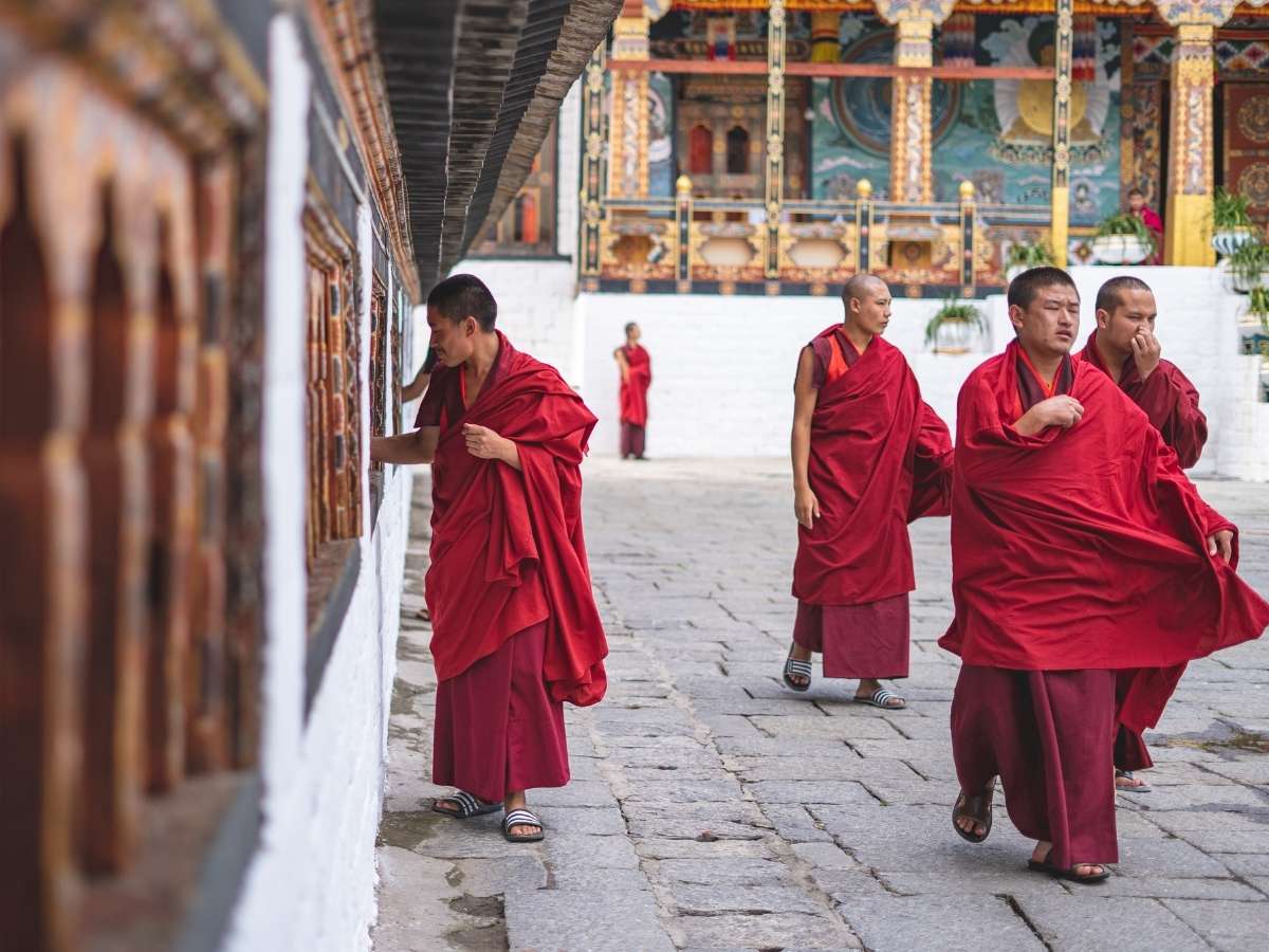 monk walking monastery Bhutan
