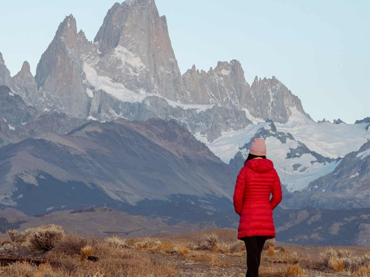 Woman in Red Jacket in Mountains in Argentina
